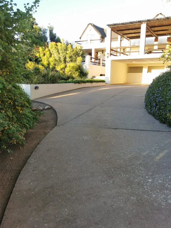 Paved driveway with secure covered parking