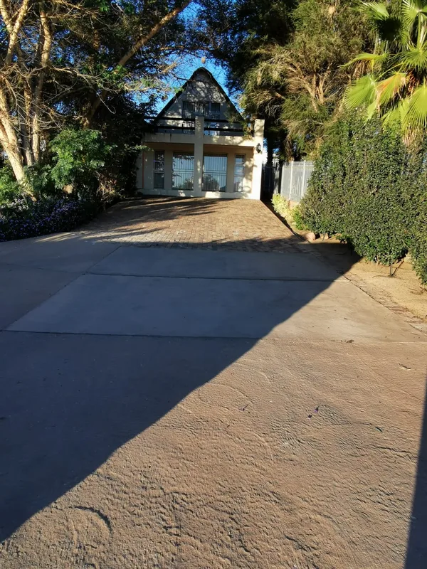 Thatched house and garden approach from quiet close