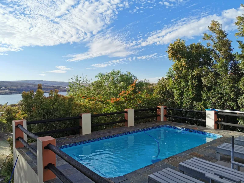 Pool deck loungers overlooking Cederberg hills